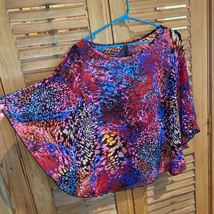 Poncho style with arms multi colored top.